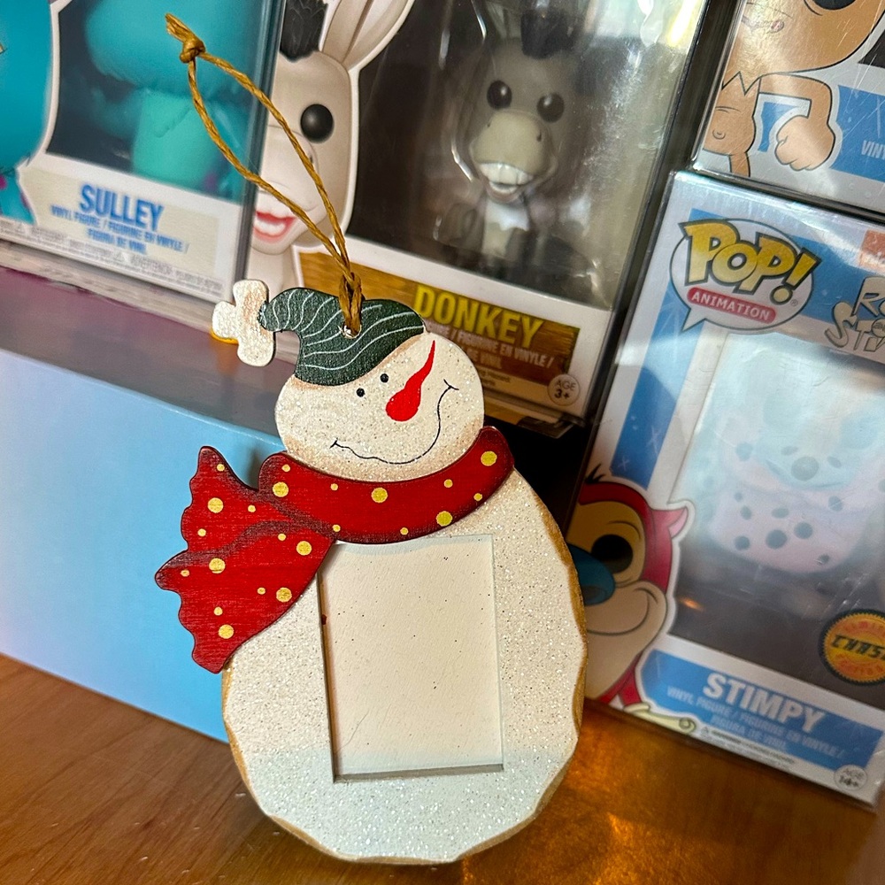 FREE with purchase $15 and up. Dazzling and super sparkly snowman picture frame